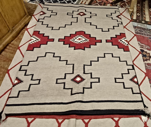 Tan, Red and Black Woolen Mills Navajo Style 5'x7' Area Rug